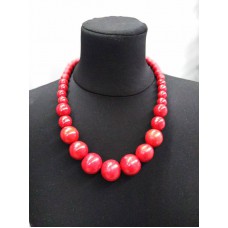 Red necklace with magnification