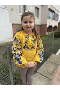 Yellow embroidered shirt for girl Vasilisa with bright floral ornament.