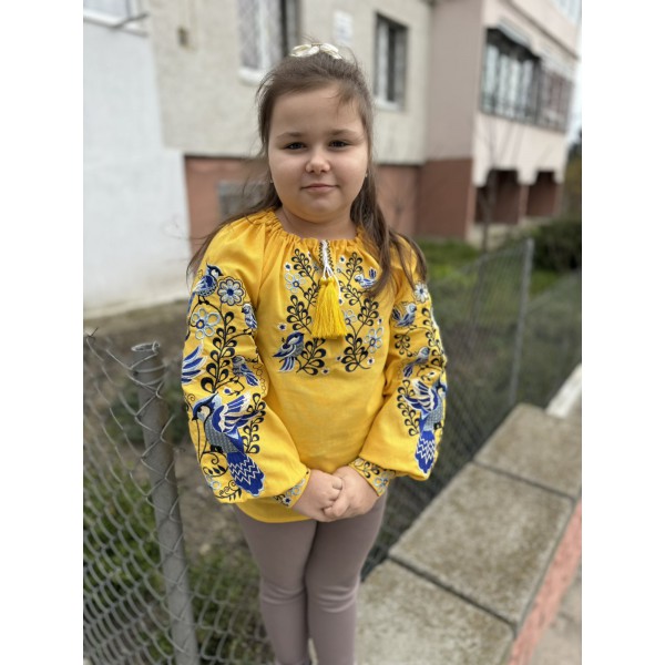 Yellow embroidered shirt for girl Vasilisa with bright floral ornament.