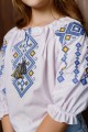 Біла дівчача вишиванка з жовто-синьою вишивкою Забава