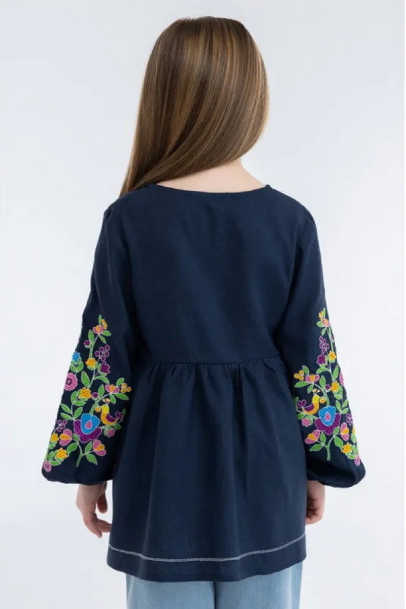 Embroidered tunic for a girl made of white linen Stasia