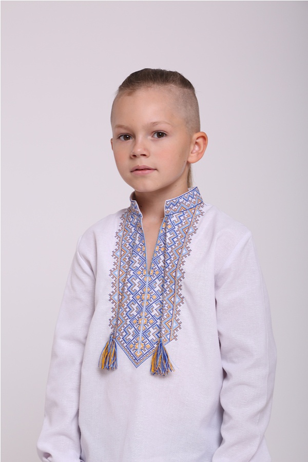 White embroidered shirt for a boy with yellow and blue embroidery 44003