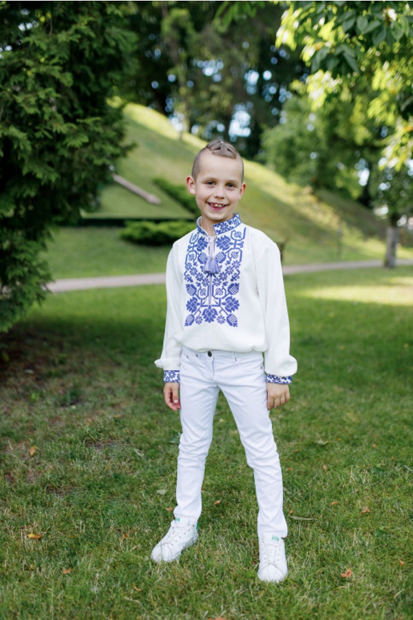 Embroidered shirt for boy Vsevolod, white fabric, blue embroidery with bright ornament.