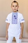 Boy’s embroidered shirt “Zoryanchyk”, white with blue. Cross-stitch embroidery on the bib front and sleeves.