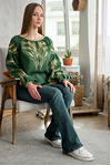 Green women's embroidered shirt with ears of wheat in a bouquet.