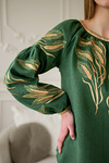 Green women's embroidered shirt with ears of wheat in a bouquet.
