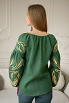 Green women's embroidered shirt with ears of wheat in a bouquet.