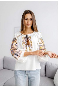 Women's milk embroidered shirt with gold embroidered neckline.