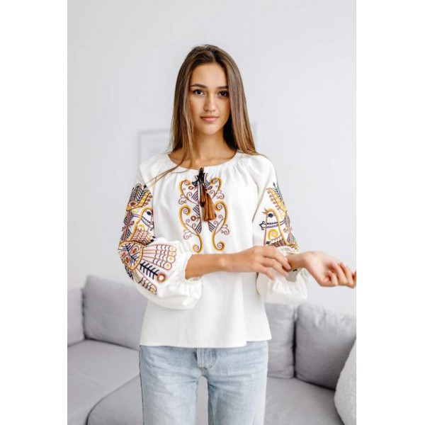 Women's milk embroidered shirt with gold embroidered neckline.