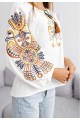 Women's milk embroidered shirt with gold embroidered neckline.