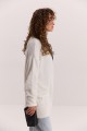 Жіночий в`язаний кардиган oversize молочний з пухнастої пряжі