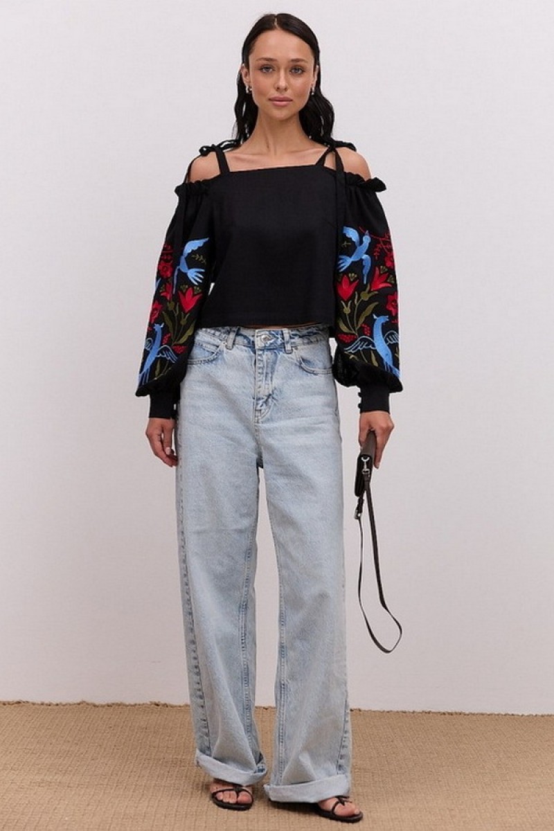 Black embroidered shirt with open shoulders and long sleeves May