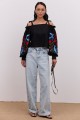 Black embroidered shirt with open shoulders and long sleeves May
