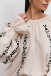 Women's embroidered blouse in light beige melange with black satin-stitched flowers