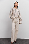 Women's embroidered blouse in light beige melange with black satin-stitched flowers