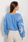 Women's vyshyvanka Swallows, blue with white embroidery on the sleeves