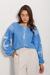 Women's vyshyvanka Swallows, blue with white embroidery on the sleeves
