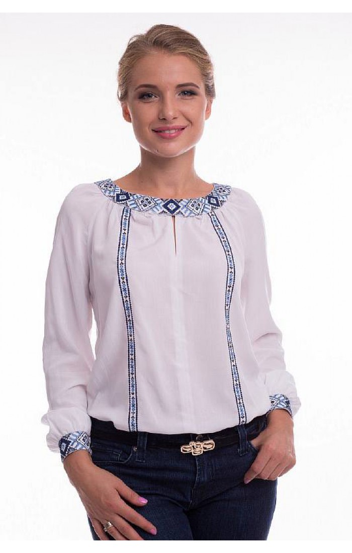 Charming, women's embroidered shirt made of white staple