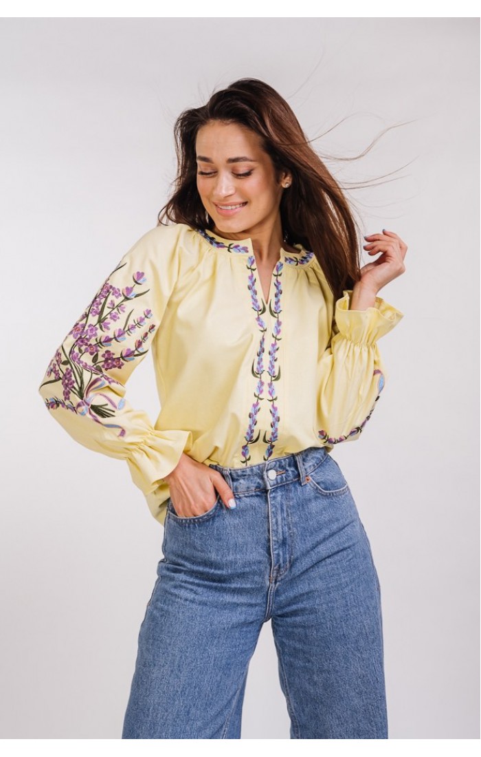 Women's white embroidered shirt with a bouquet on the sleeves