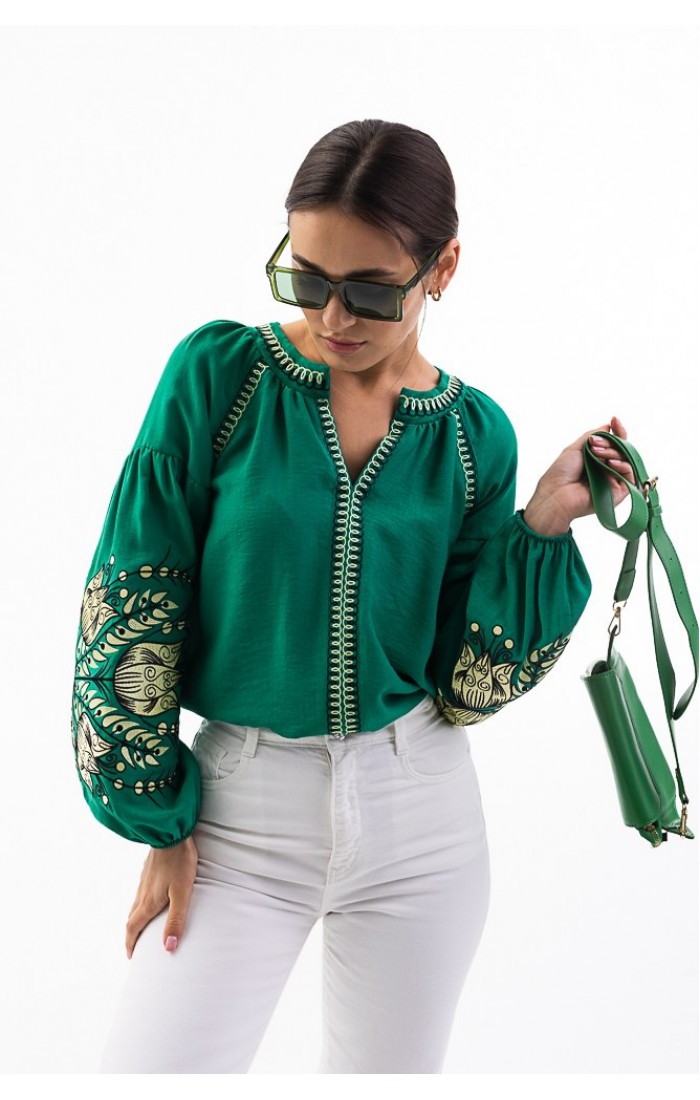 Women's green embroidered shirt with flowers on the sleeves