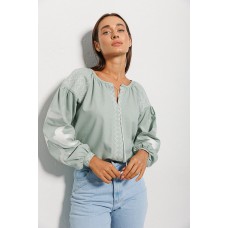 Green women's embroidered shirt with swallows