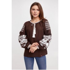  A delicate, embroidered women's coat of brown color with white embroidery