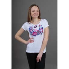 An elegant white embroidered shirt with a floral motif is a symbol of Gloria