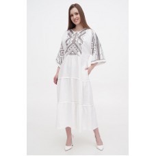 Boyana's long white embroidered linen dress is new