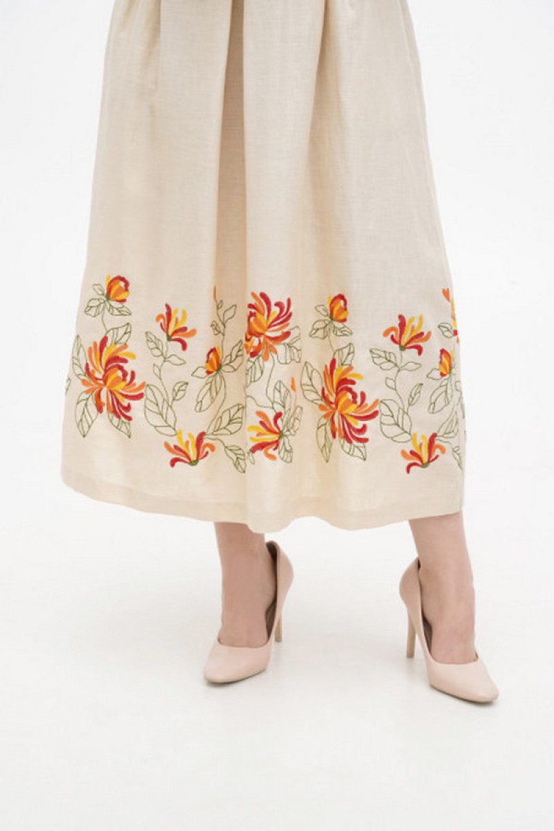 Dress made of beige linen with "Kvita" embroidery - sleeveless style with a fitted waist.