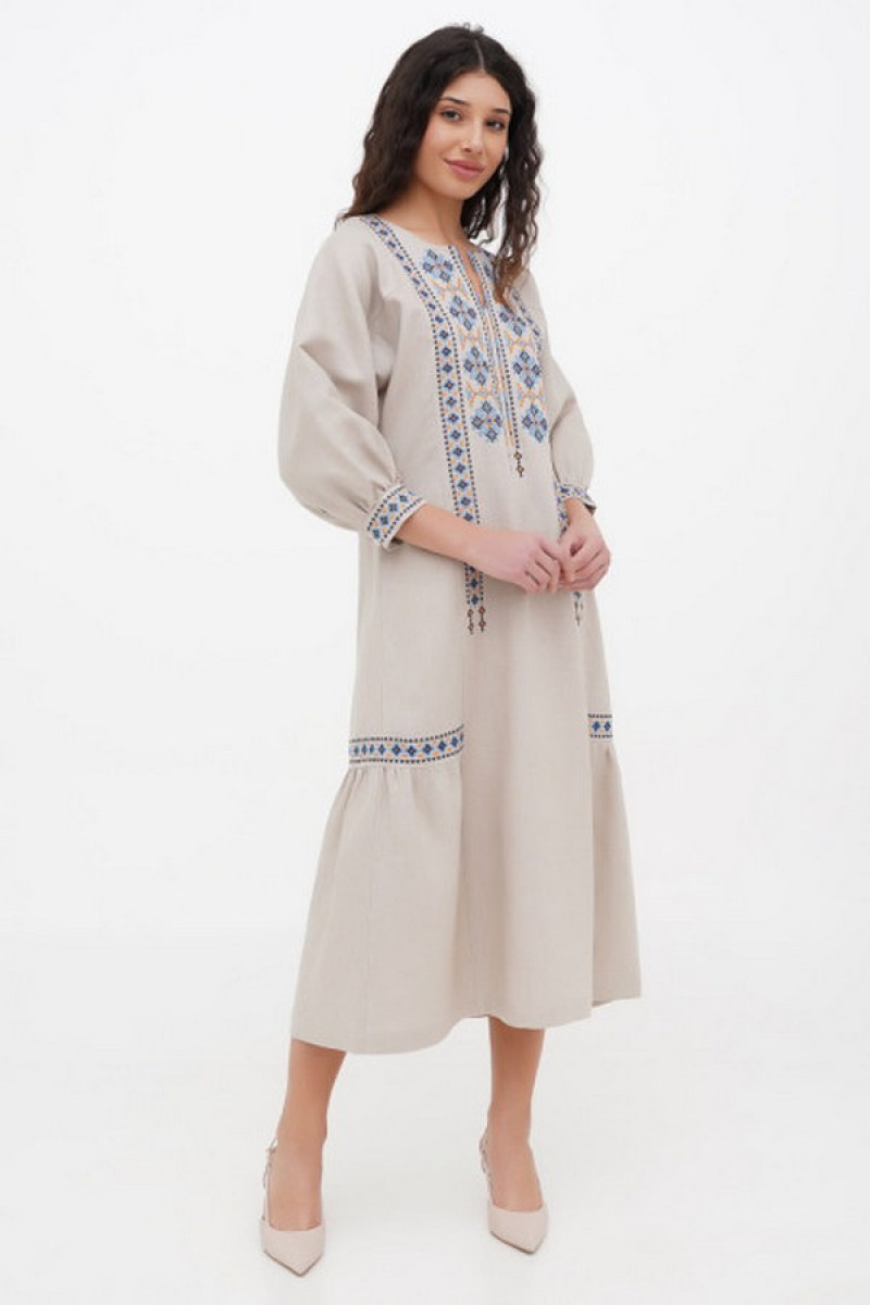 Dress made of beige linen with "Kvita" embroidery - sleeveless style with a fitted waist.