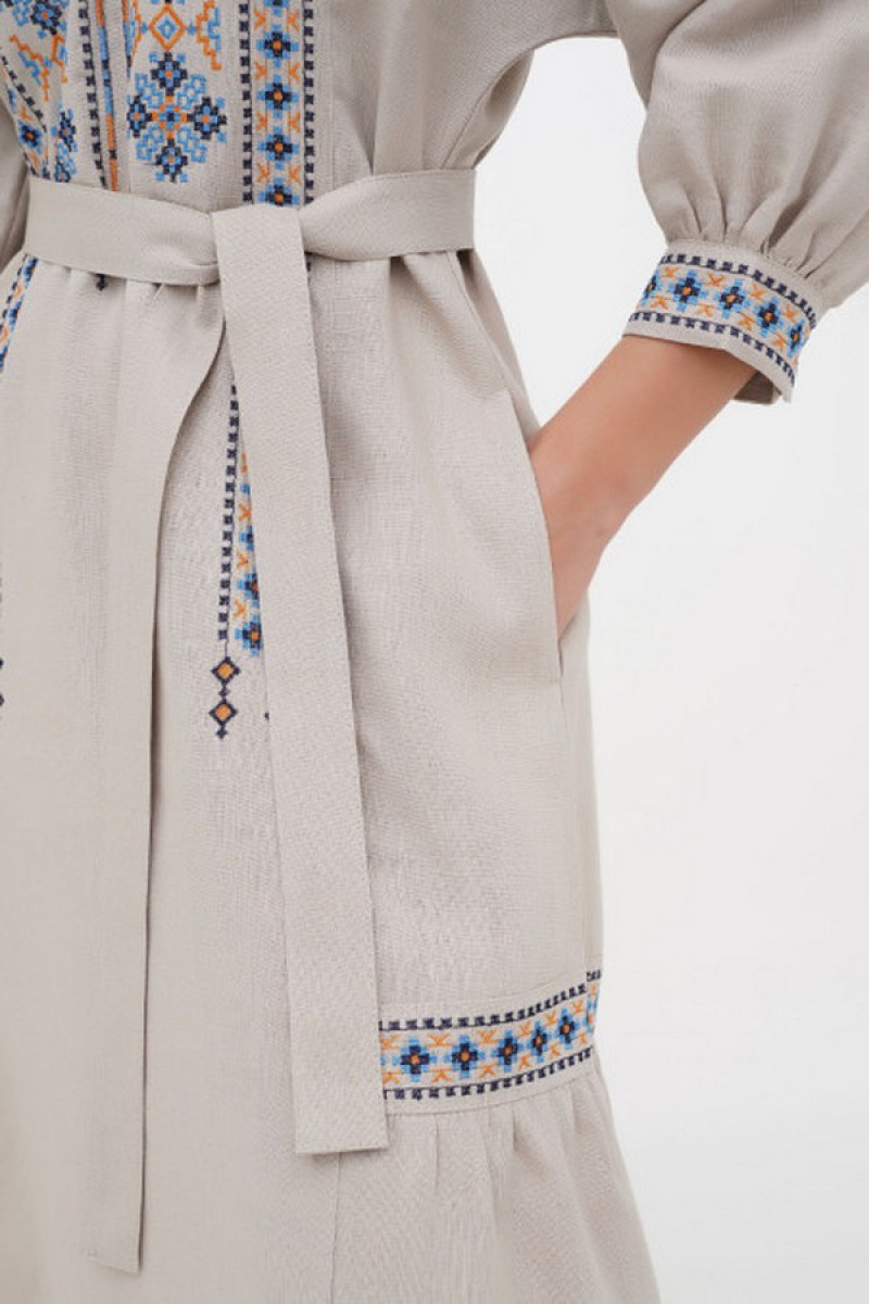 Dress made of beige linen with "Kvita" embroidery - sleeveless style with a fitted waist.