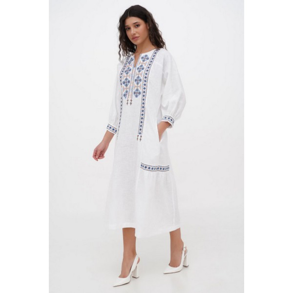 Dress made of white linen with Morika embroidery