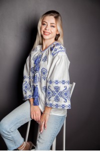 White embroidered shirt Karina with blue embroidery.