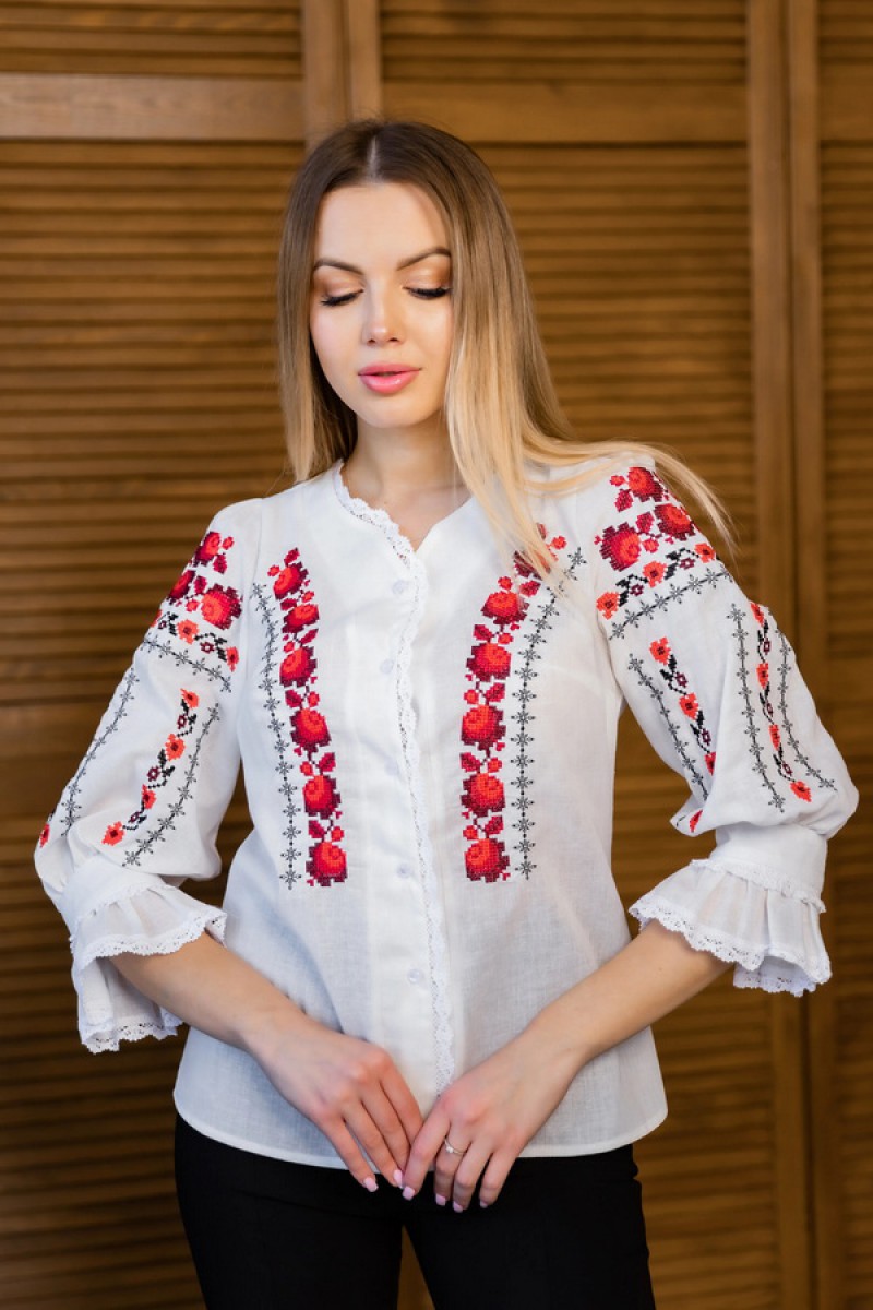 Women's milk embroidered shirt with gold embroidered neckline.