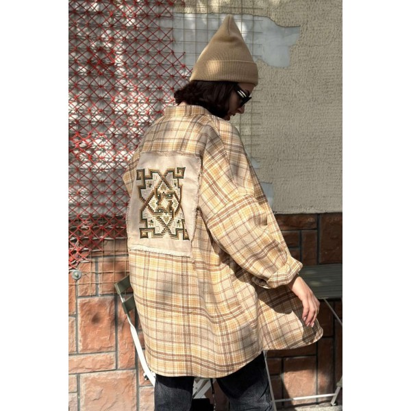 Women's shirt in brown color with embroidery on the back